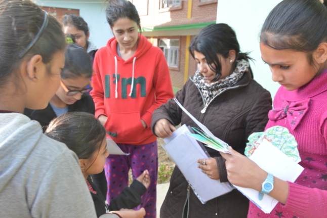 Deepa Subedi from READ hands out the letters to rural children